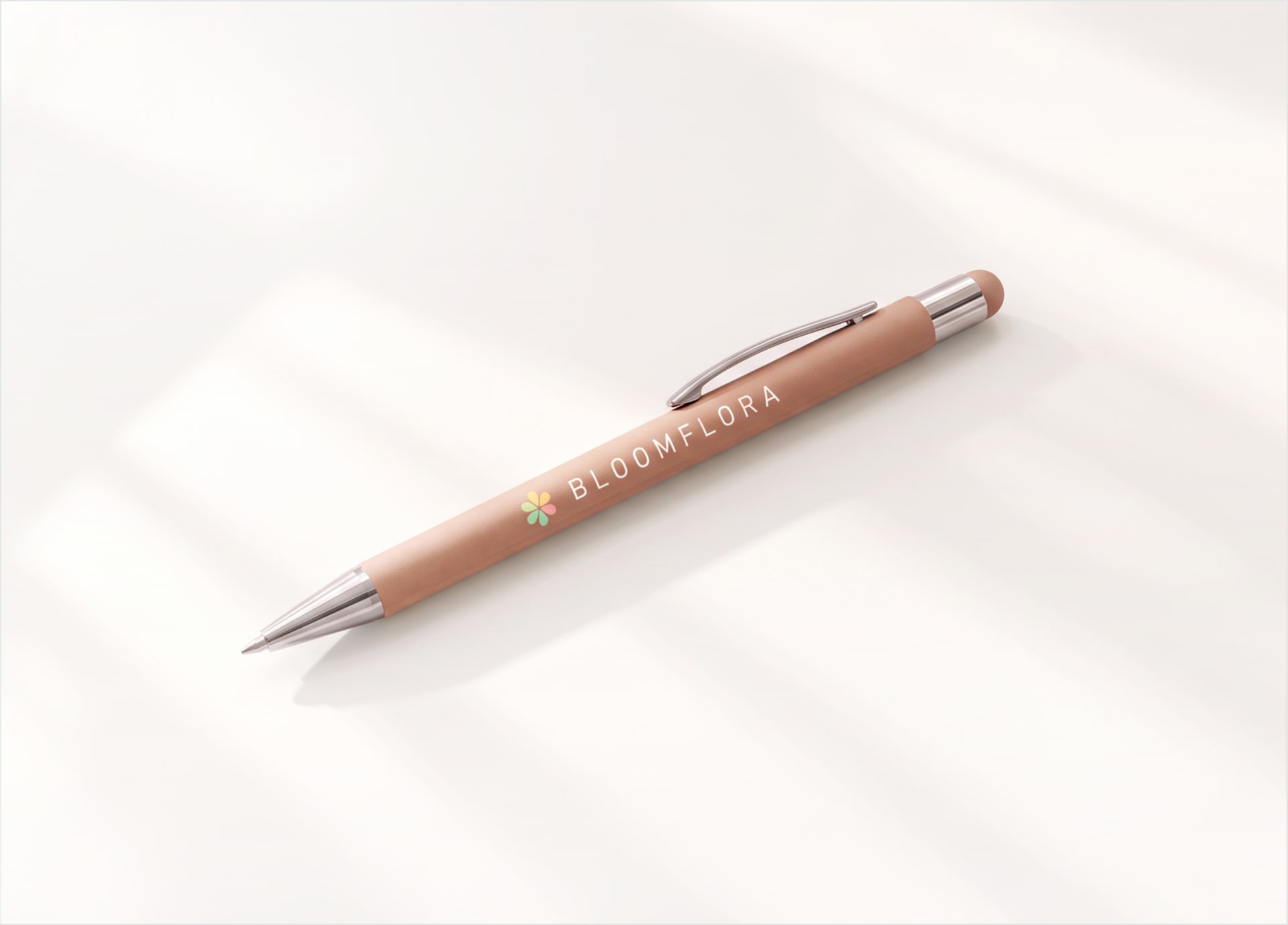 A custom Bowie pen in a painted rose finish with chrome trim and a full-colour logo